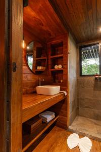a bathroom with a sink and a mirror at Naturave Monteverde - Treetop Cabins in Monteverde Costa Rica