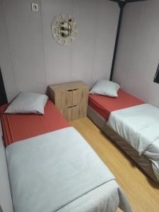 a room with two beds in a room at Studio MAT in Herly +12 photos