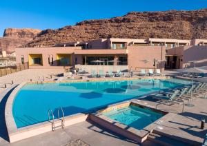 a large swimming pool in front of a building at EBAC Moab in Moab