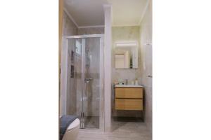 a bathroom with a shower and a sink at Pella Luxury Archonta in Pélla +28 photos