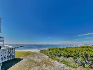a view of the ocean from the balcony of a house at Sandcastle Townhomes #24 in Navarre