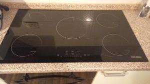 a microwave oven sitting on top of a counter at Mansarda Casalina in Casole Bruzio +9 photos
