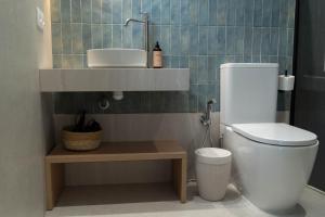 a bathroom with a toilet and a sink at Ceramic Rooms Boutique Hostel in Villareal +38 photos