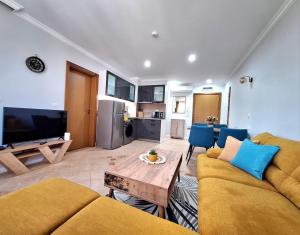 a living room with a couch and a table at Marina Forest in Sozopol
