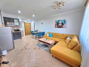 a living room with a couch and a table at Marina Forest in Sozopol