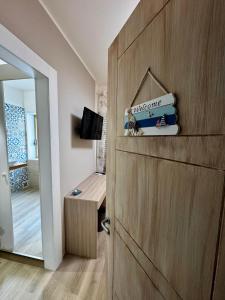 a room with a wooden door with a wooden table at Tramonto di Calabria in Pizzo +38 photos