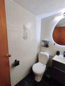 a bathroom with a toilet and a sink at Nina's Cozy Home in Chrani +38 photos