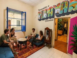 a group of people sitting in a room at Lienzo Hostal Popayán in Popayan