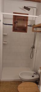 a bathroom with a tub and a toilet and a sink at Finca Blanca Formentera in Sant Francesc Xavier +40 photos
