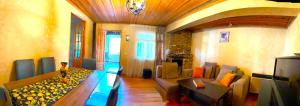 a living room with a couch and a table at Cozy Corner in Borjomi