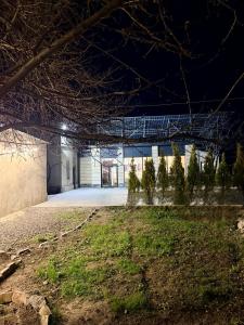 an exterior view of a building at night at Hotel MARUNA in Sevan