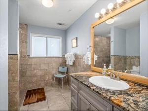 a bathroom with a sink and a mirror at Meadowlark Retreat in Ahwahnee +36 photos