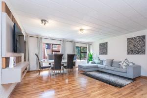 a living room with a couch and a table at 3 bed ground in sandton in Johannesburg