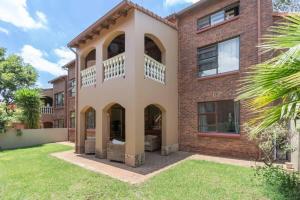 an exterior view of a brick house at 3 bed ground in sandton in Johannesburg