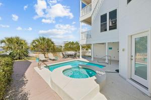 an exterior view of a house with a swimming pool at Dock N Dune by 30A Escapes in Seagrove Beach
