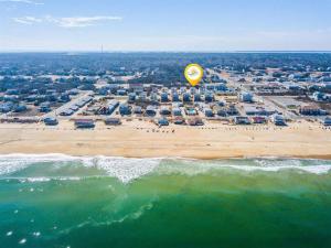 an aerial view of a beach with a yellow balloon at 4058 - Beach Haven in Kitty Hawk