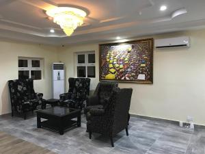 A seating area at Msquare Hotel GRA