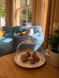 a plate of food on a table in a living room at Ingleside in Lynton