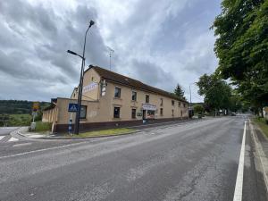 an empty street with a building on the side of the road at Himalaya Budget Inn in Niederanven