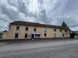 a building sitting on the side of a street at Himalaya Budget Inn in Niederanven