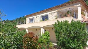 a large house with trees in front of it at La benvingude CH d'hôte in Nyons