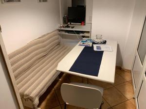 a small room with a table and a chair at The Grimme Residence in Xiropigado