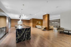 a large room with a kitchen and a living room at Executive Condo with Parking DT Ottawa in Ottawa