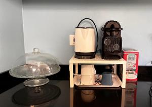 a table with a coffee maker and a blender at Casa Stella in Venzone