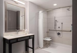 a bathroom with a sink and a shower at Courtyard by Marriott Boston Brookline in Brookline