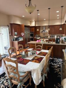 a kitchen with a table with chairs and a kitchen with at Waterfront home in Gig Harbor