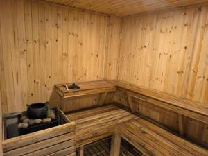 a wooden sauna with a bucket and balls in it at CasaSue Living & Hotel in Bogotá