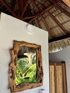 a mirror on the wall of a room at Casa Mario Alberto - Oceanfront Bungalows in Puerto Ángel