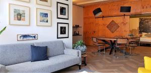a living room with a couch and a table at Oak & Beam Atelier in Haarlem