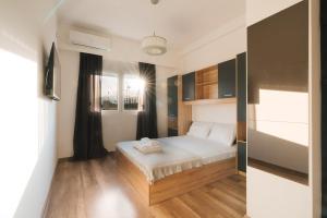 a bedroom with a bed in a room at Apartments BUBBLES with pool in Gevgelija +18 photos