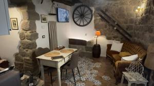 a living room with a couch and a table at C'era una volta in Abbadia San Salvatore