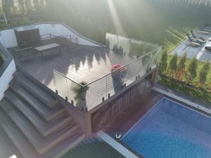 an overhead view of a deck with a swimming pool at Villa med pool in Bara