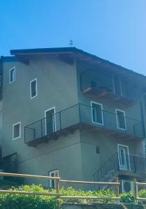 a building with balconies on the side of it at Il borghetto di Lele & Schina in Arvier