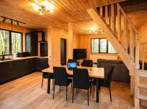 a kitchen and dining room with a table and chairs at Secret Sanctuary in Brad +9 photos