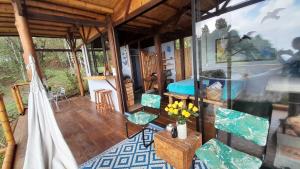 a living room with a room with a bed and a table at Lunanueva in Cali