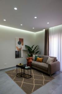 a living room with a couch and a table at Alba Stays in Ladispoli
