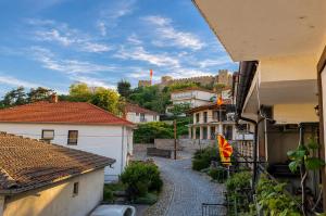 a view of a street in a town with buildings at Apartments NOCE - Premium Lake View in Ohrid +26 photos