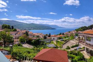 a view of a town with a large body of water at Apartments NOCE - Premium Lake View in Ohrid