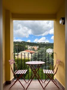 a balcony with a table and two chairs at Hotel Tall de Conill in Capellades +51 photos