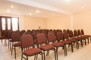 a row of chairs lined up in a room at Pousada Corsario Buzios in Búzios +134 photos