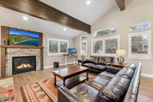 a living room with a couch and a fireplace at Chalet Near The Tahoe Keys in South Lake Tahoe