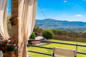 a balcony with a view of a mountain at The House Olympia - Happy Rentals in Olympia +27 photos