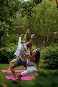 a group of people doing yoga in the grass at Mision del Sol Resort & Spa Adults Only in Cuernavaca