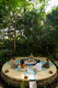 a group of people sitting around a circular table at Mision del Sol Resort & Spa Adults Only in Cuernavaca +81 photos