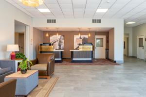 a lobby of a hospital with couches and chairs at Hawthorn Extended Stay by Wyndham Ellsworth Bar Harbor in Ellsworth