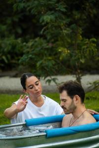 a woman and a man sitting in a boat at Mision del Sol Resort & Spa Adults Only in Cuernavaca
